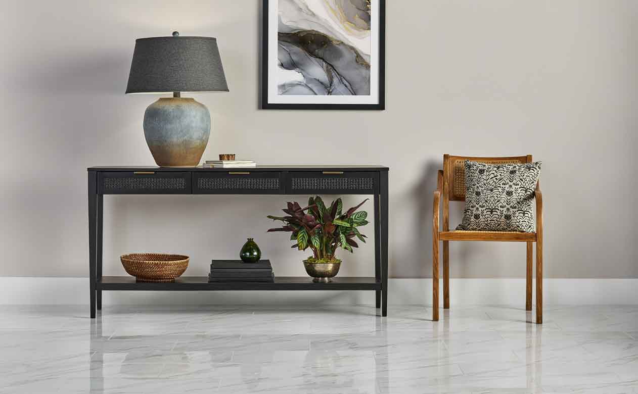 Living room with Woven Drawer Console Table Black and marble look tile flooring in Aberdeen, WA 